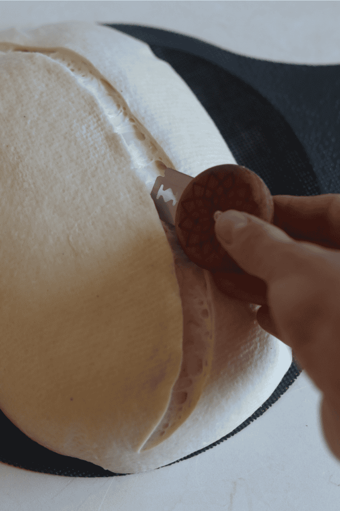 scoring the sourdough bread dough