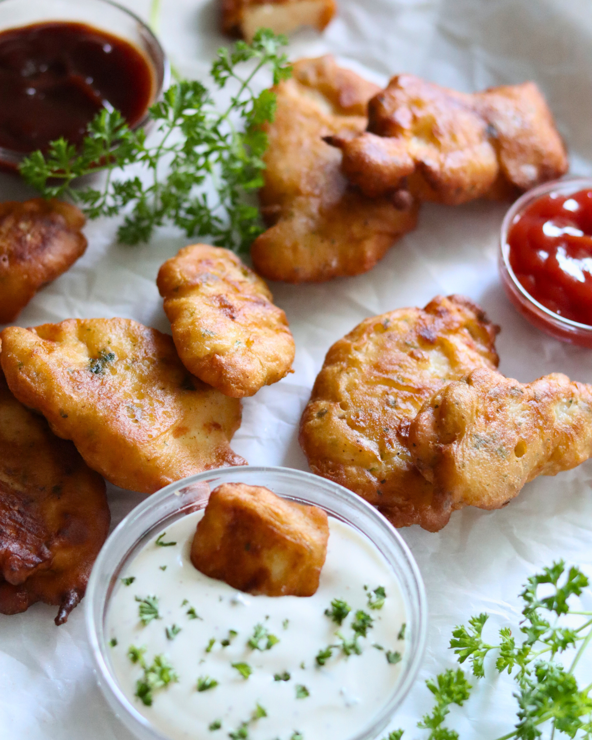 Sourdough Chicken Tenders with ranch, bbq, ketchup and parsley