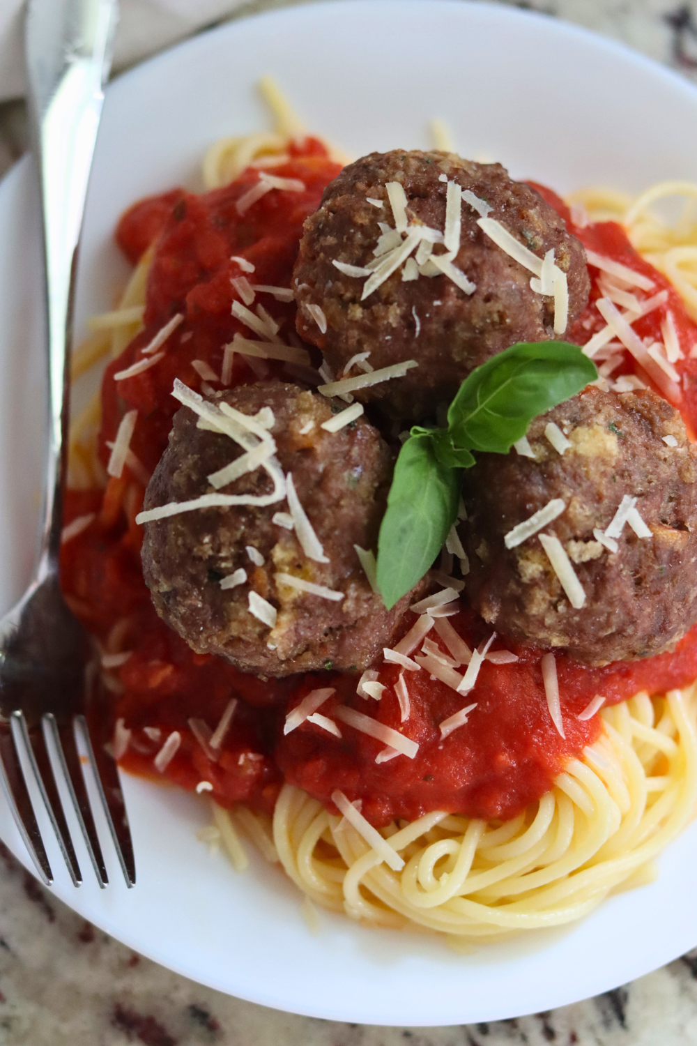 Sourdough Meatballs, tomato sauce, spaghetti with Parmesan cheese and basil