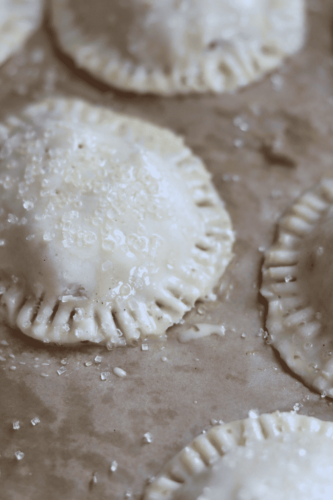 sourdough hand pies with coarse sugar on top