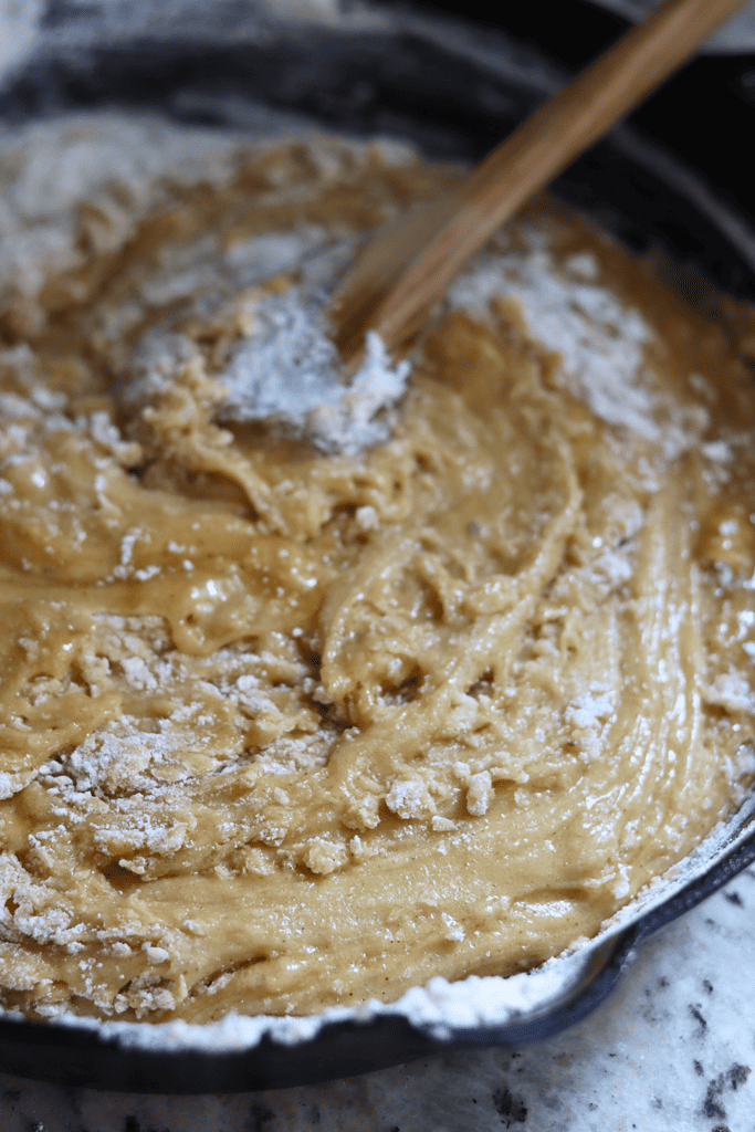 stirring in the dry ingredients with a wooden spoon