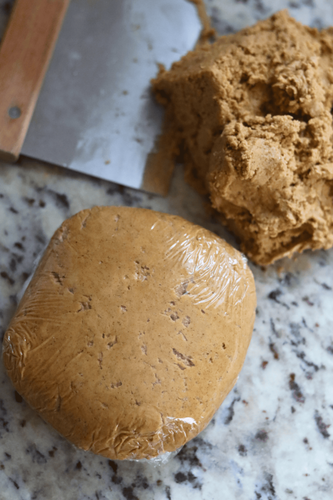 Sourdough Gingerbread Cookie batter rolled in a smooth ball