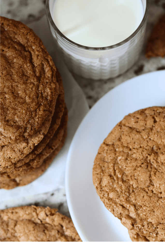 Sourdough Brown Sugar Cookies on a plate with a glass of milk