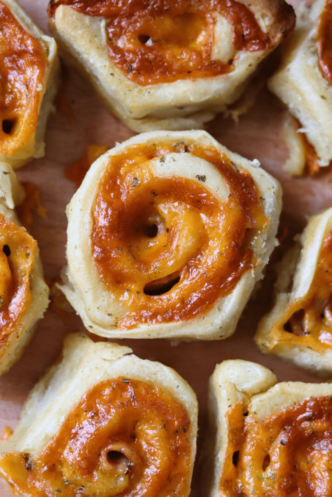 Ham and Cheese Sourdough Pinwheels on a cutting board