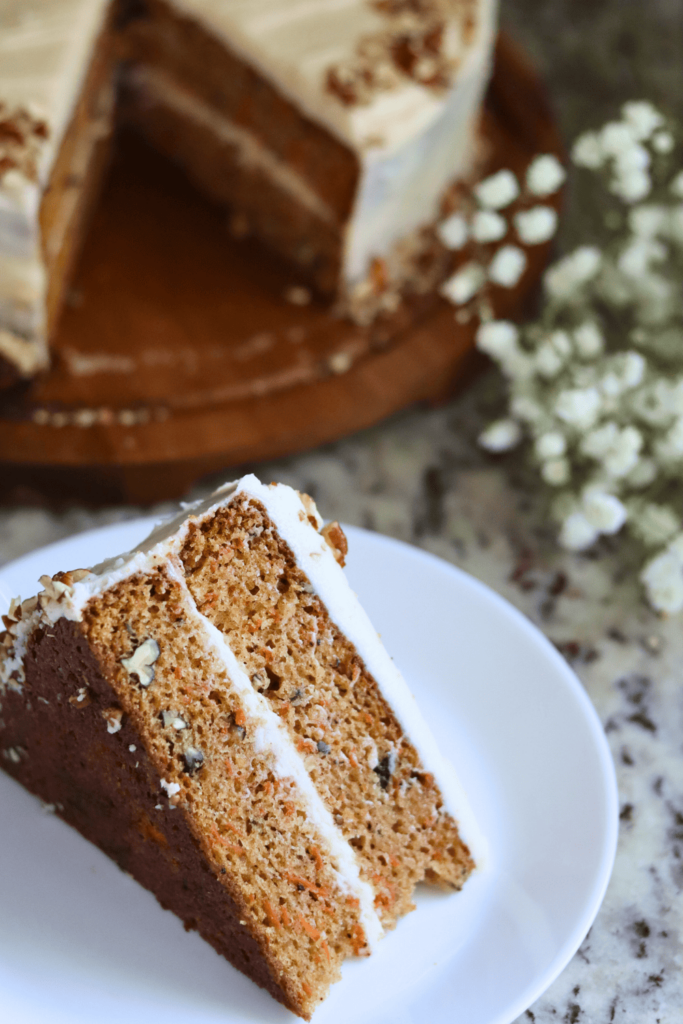 A slice of Sourdough Carrot Cake on a plate