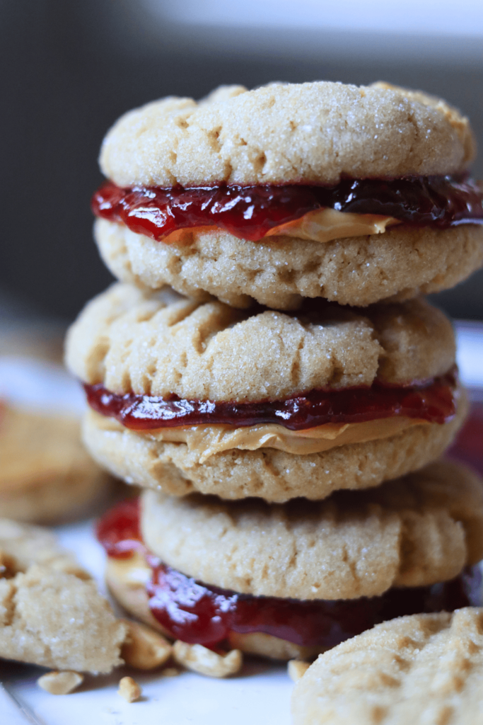 Sourdough Peanut Butter and Jelly Sandwich Cookies stacked on top of each other