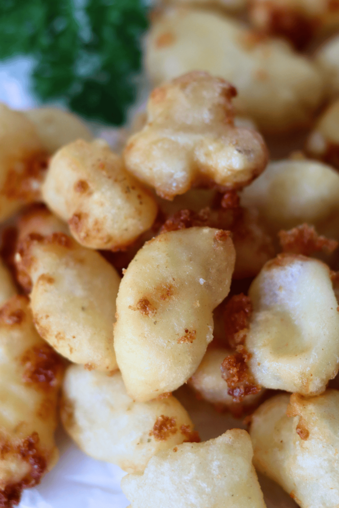 Sourdough Fried Cheese Curds on parchment paper