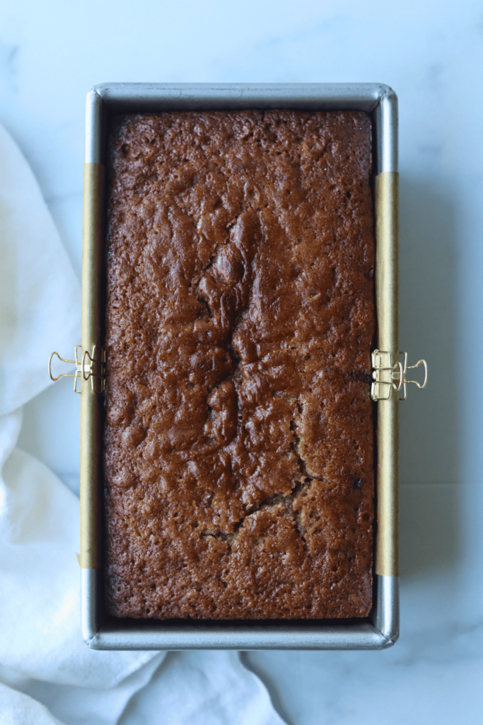 baked apple cider donut bread in a pan