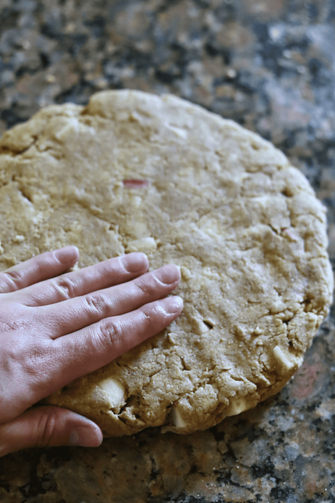 flattening the round disc of dough