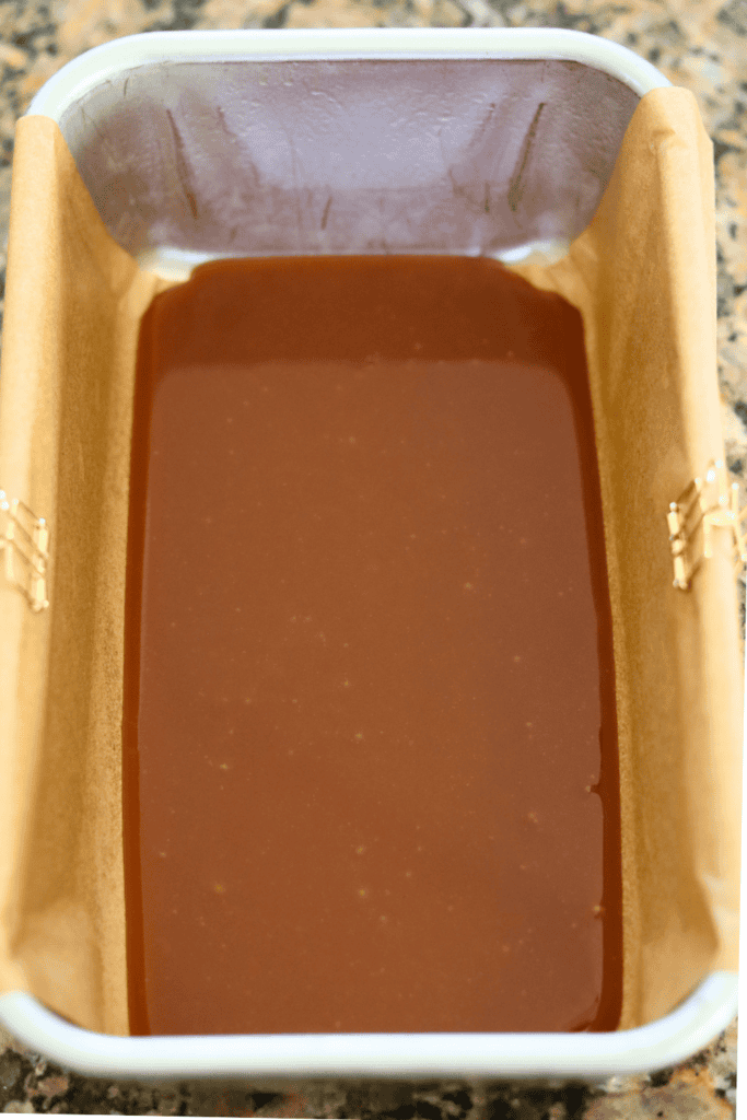 spread out caramel at the bottom of the pan