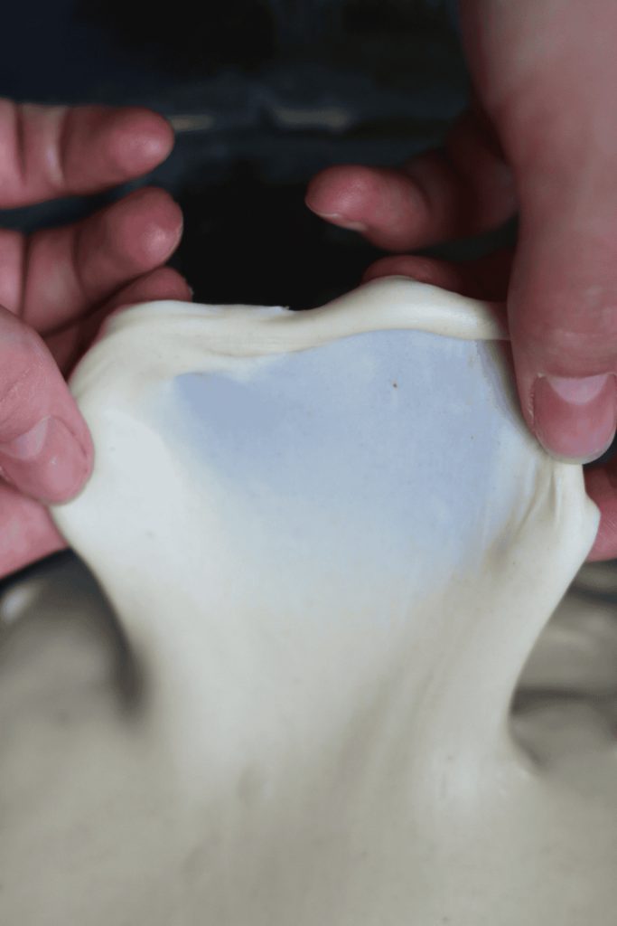 dough being stretched