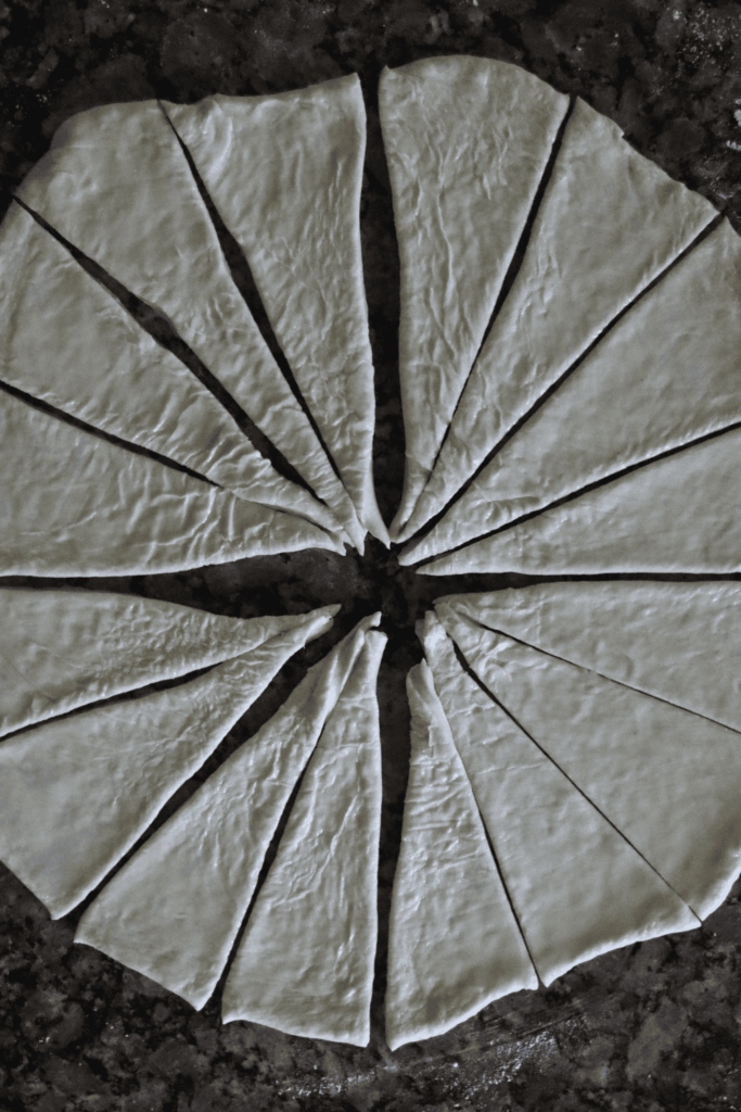 dough divided into triangle pieces