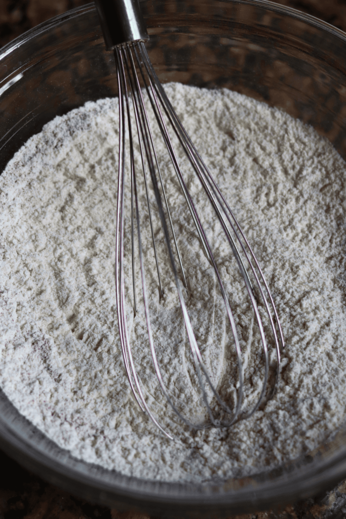 mixed ingredients in a bowl with whisk