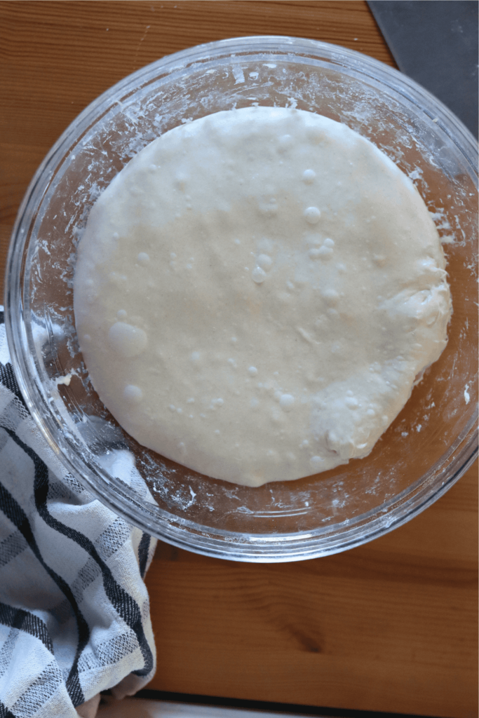 dough in a bowl that has completed its bulk fermentation