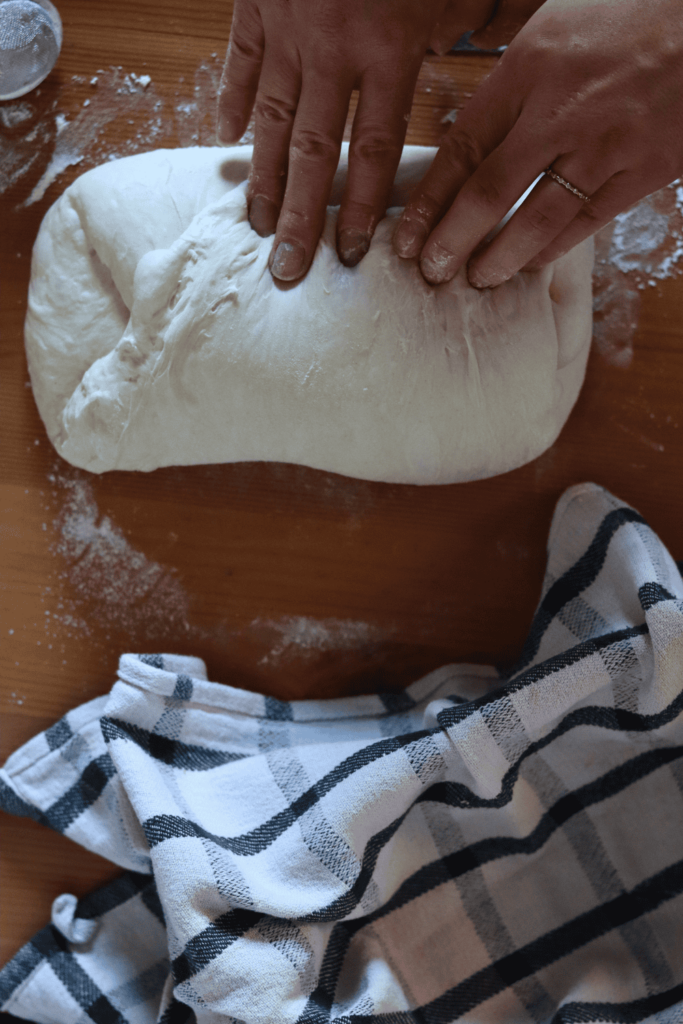 shaping a loaf of sourdough