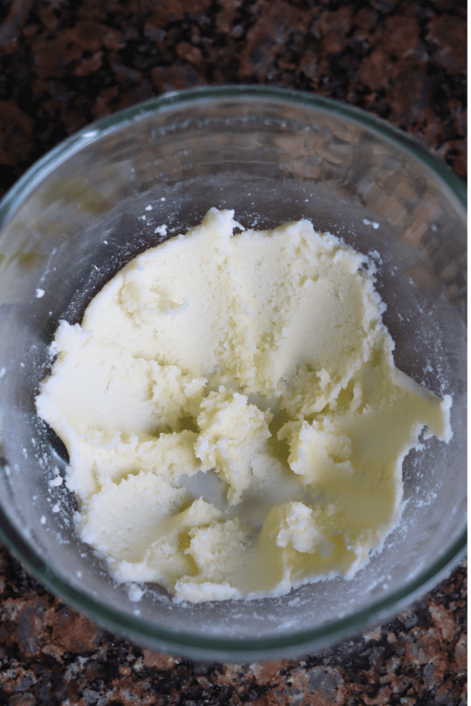 butter and sugar mixed together in a glass bowl