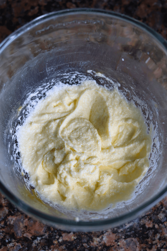 butter and sugar mixed together in a glass bowl