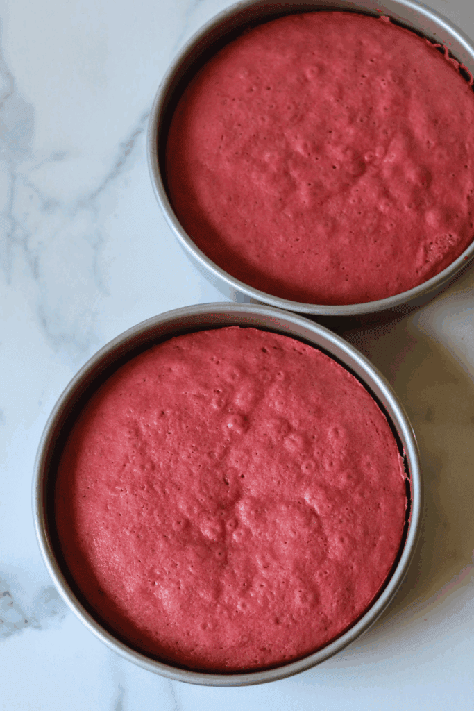 two pans of baked sourdough strawberry cake