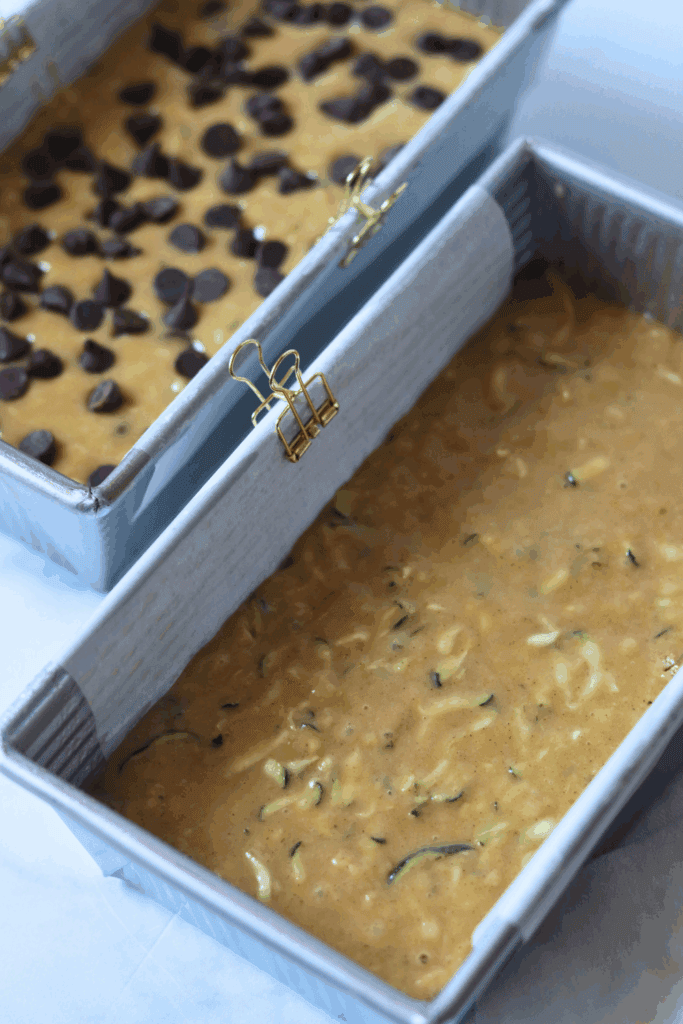 batter with zucchini and chocolate chips in a loaf pan