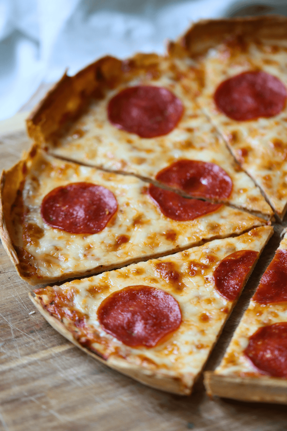 a close up of sliced Sourdough Discard Pizza Crust