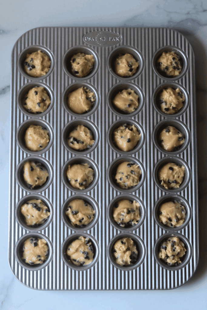 scooped muffin batter into the muffin tin