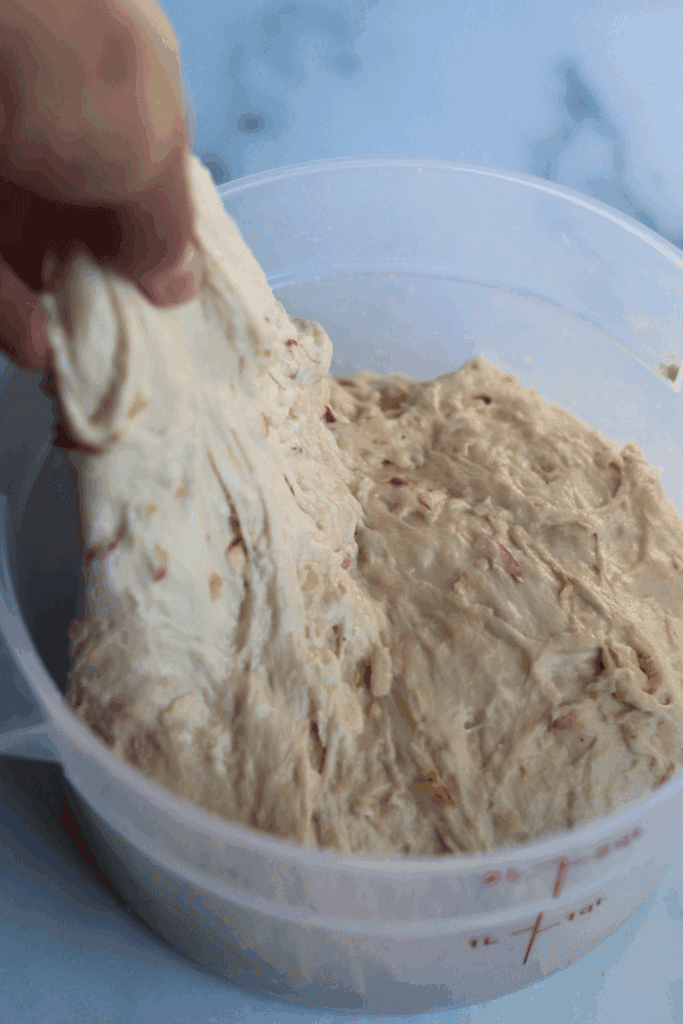 pulling a piece of dough above