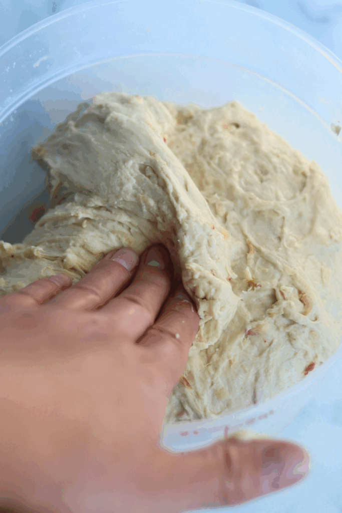 folding the dough in the middle 