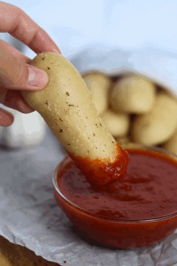breadstick dipped in sauce
