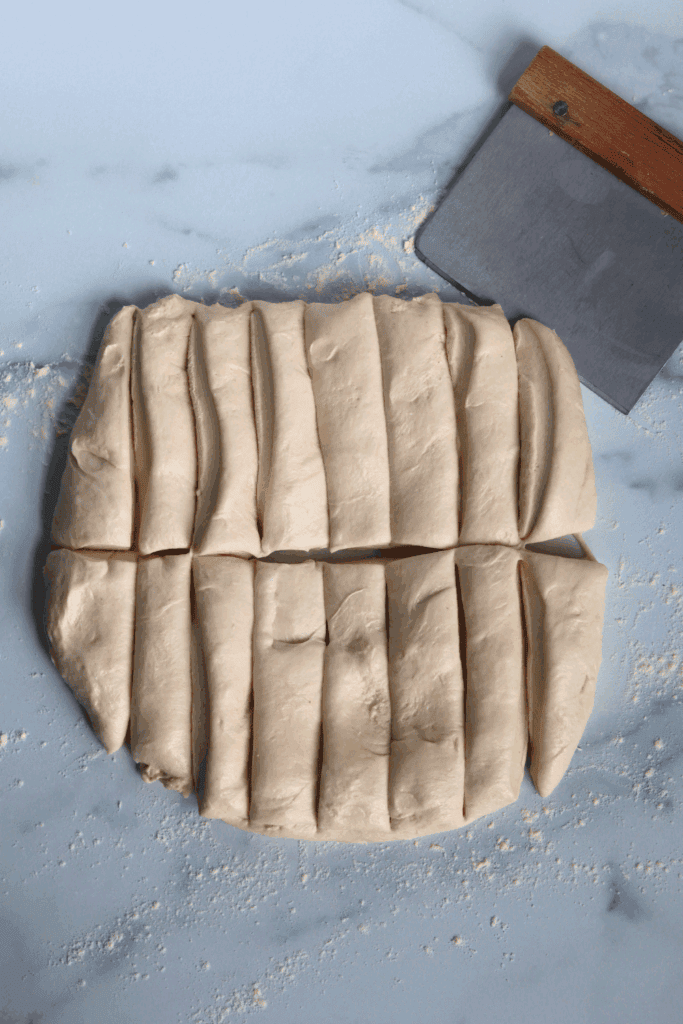 rolled dough divided into thin pieces