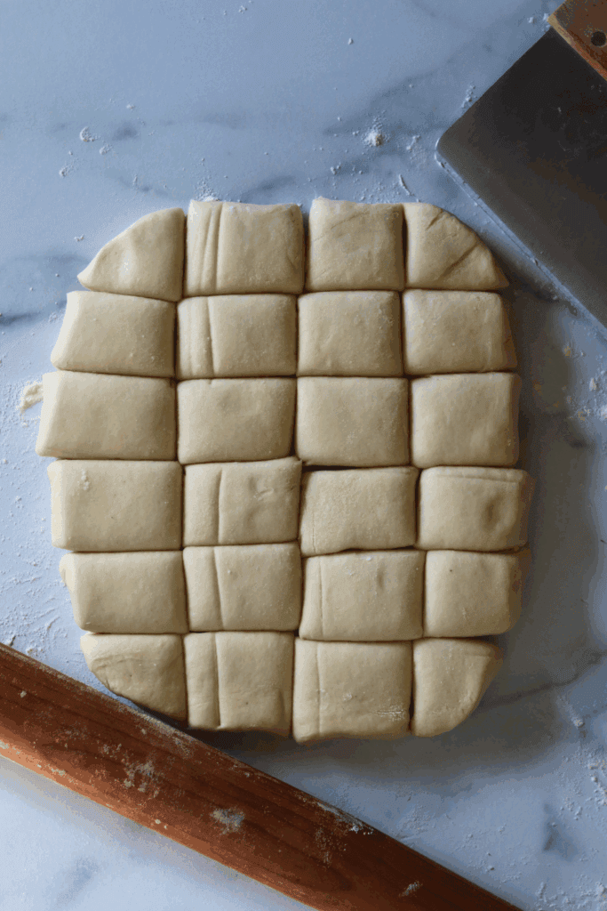 rolled dough divided into rectangle pieces