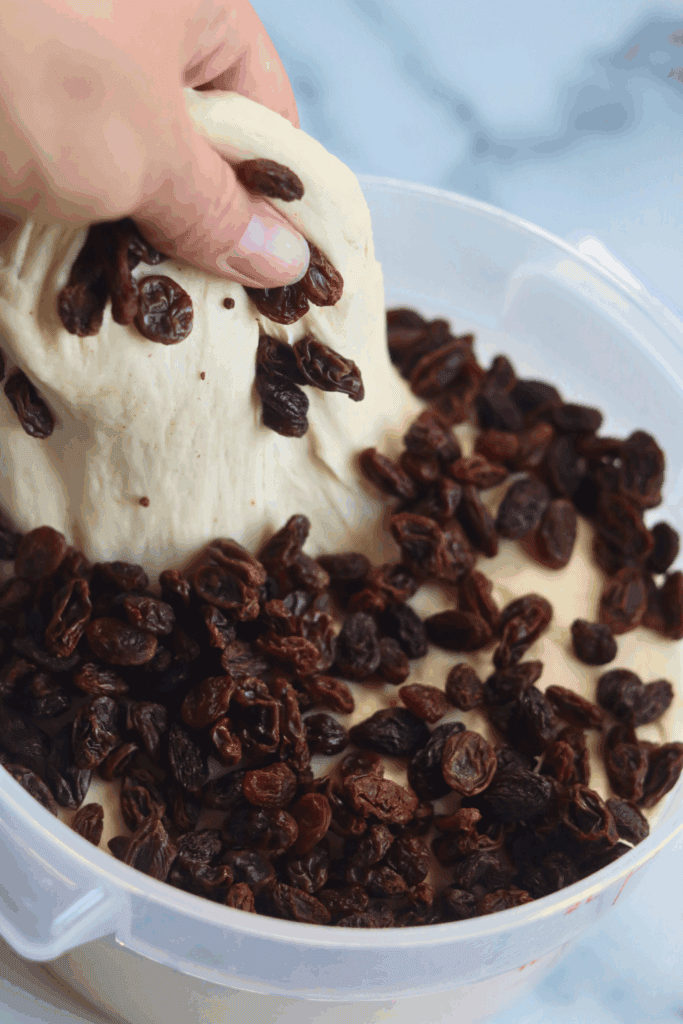 kneading the dough with raisins 