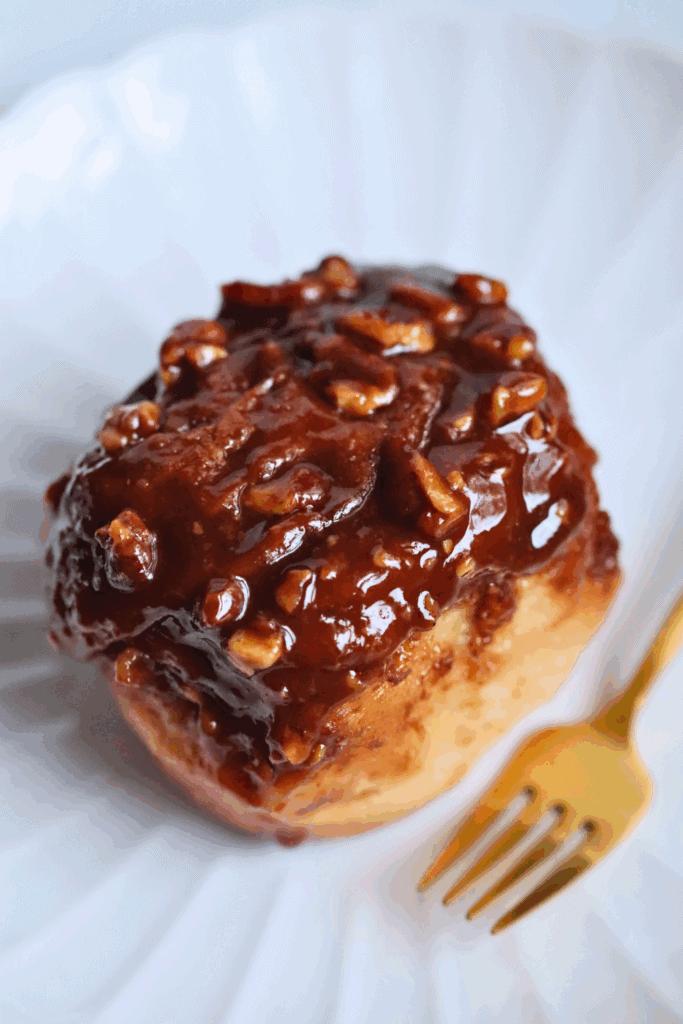 a piece of sourdough sticky bun on a plate
