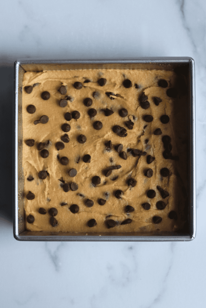 spread blondies batter into the pan