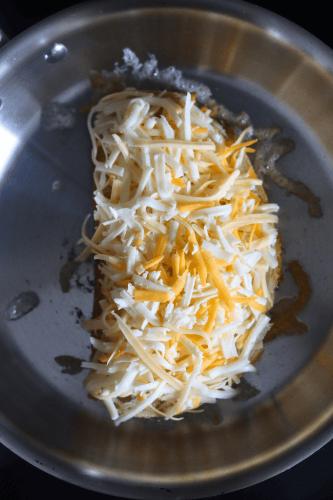 shredded cheese on top on sourdough bread