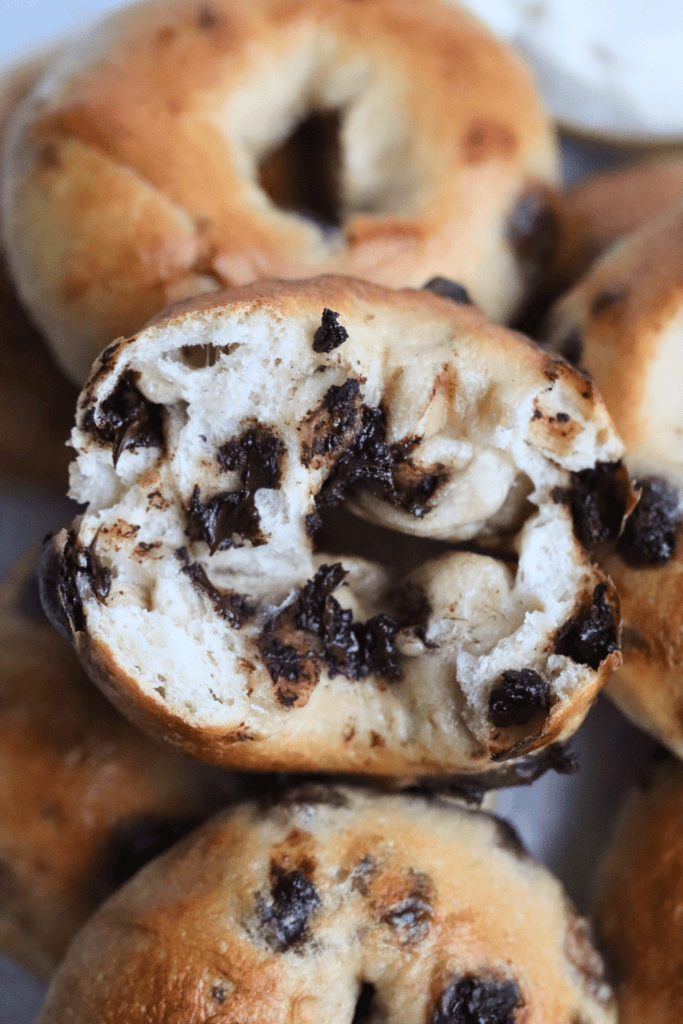 sourdough chocolate chip bagels that is broken in half