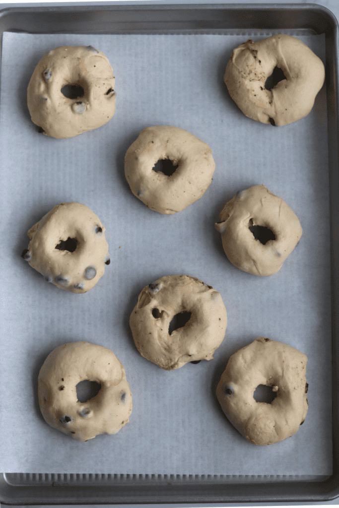 bagel dough on a baking sheet
