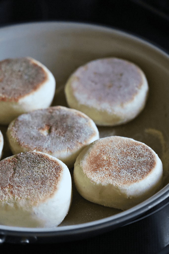 muffins being cooed at the cast iron