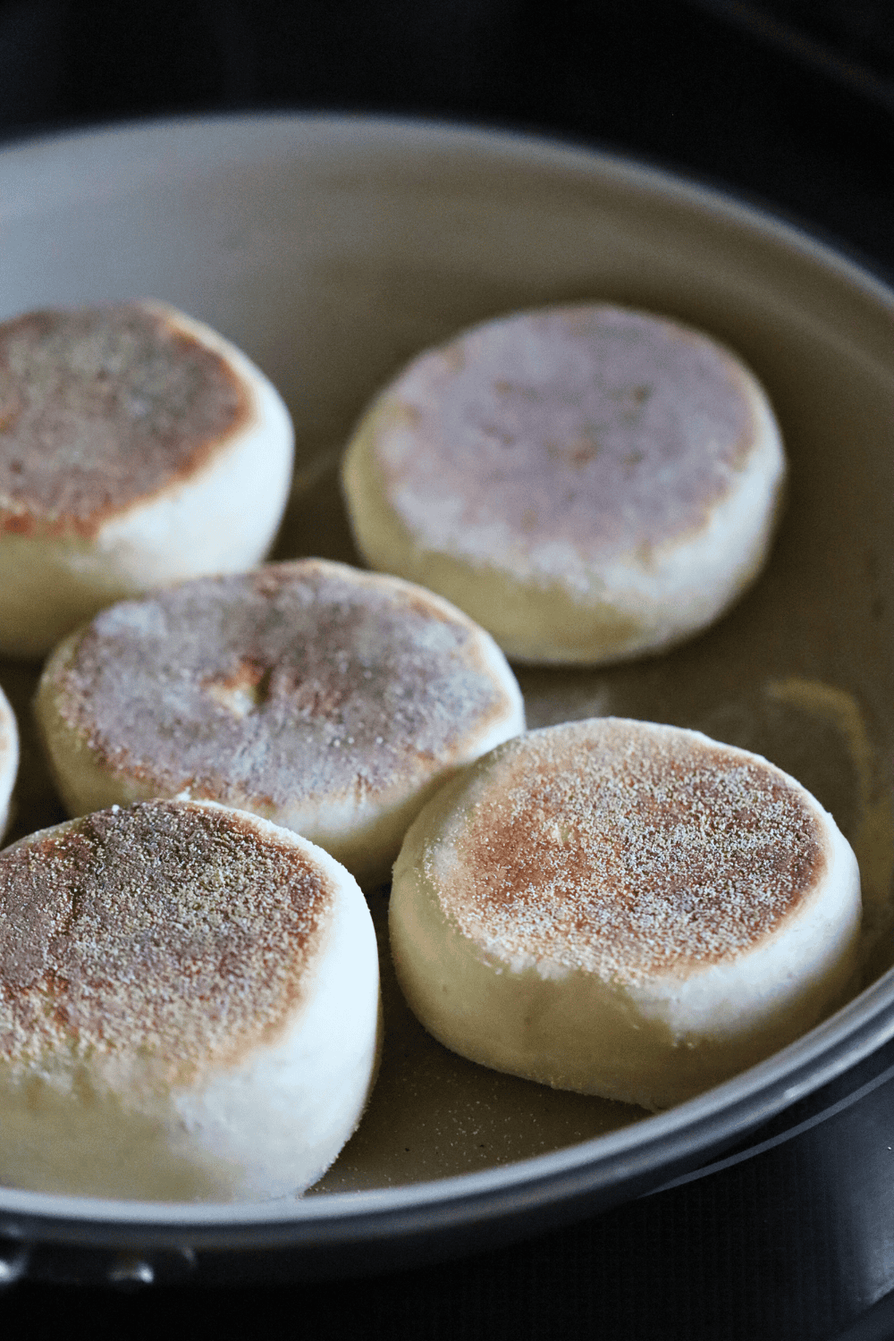 muffins being cooed at the cast iron