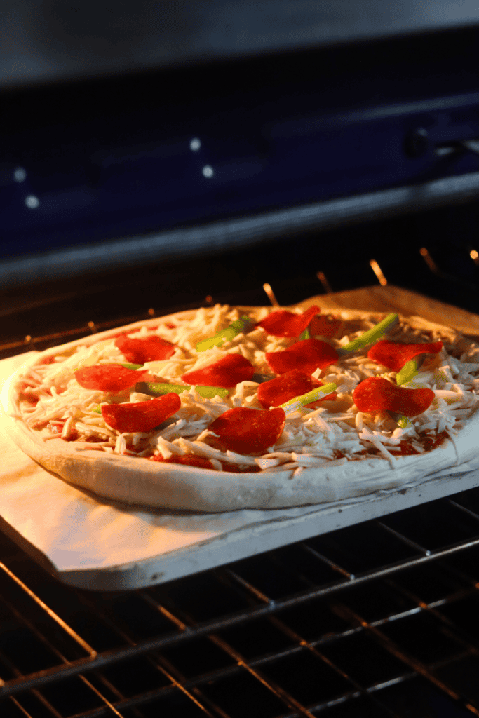sourdough discard pizza dough in a baking stone