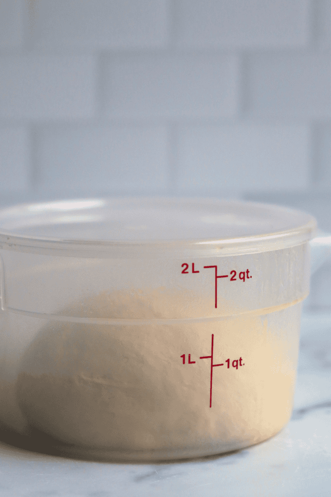 dough placed in a covered greased bowl