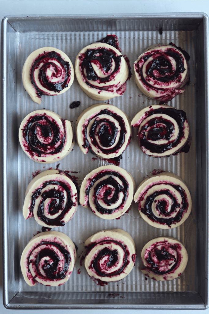 lemon blueberry sweet rolls on a pan