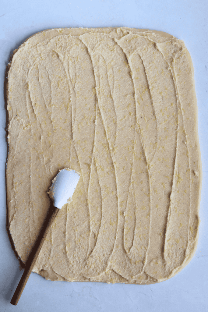 spread out lemon butter on the dough