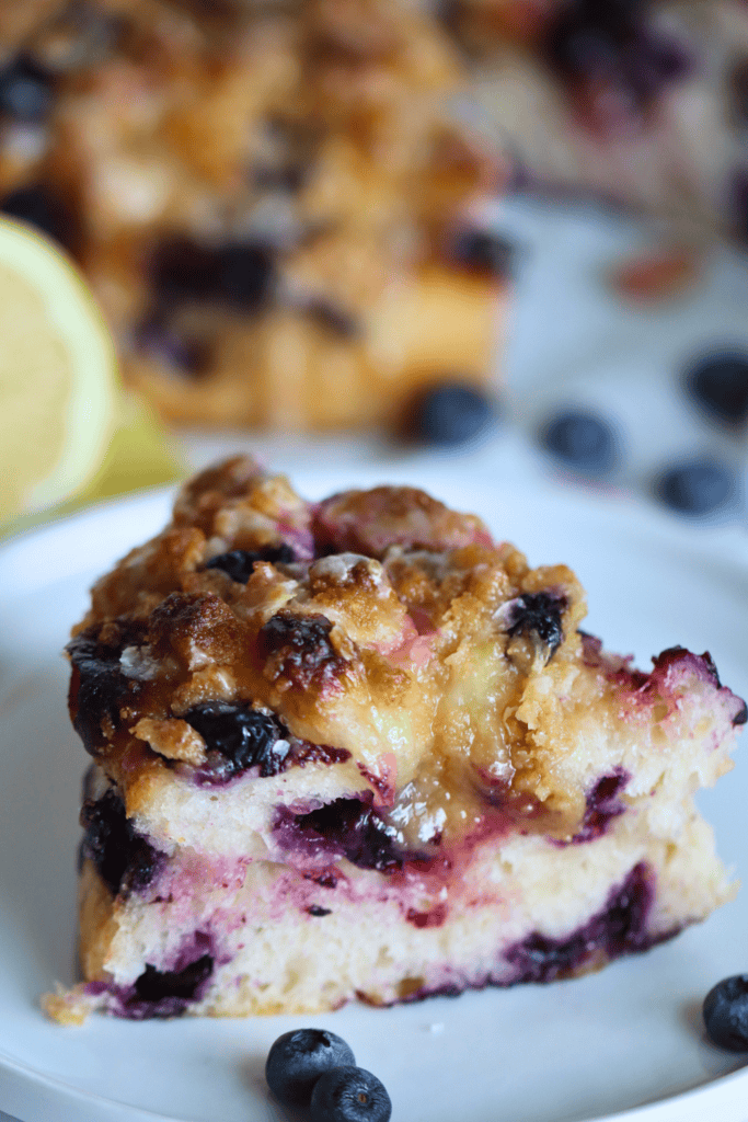 a slice of sourdough lemon blueberry focaccia