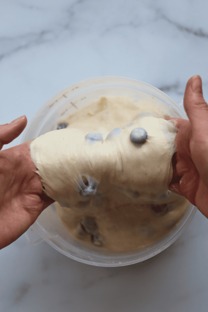 scooping the dough with both hands