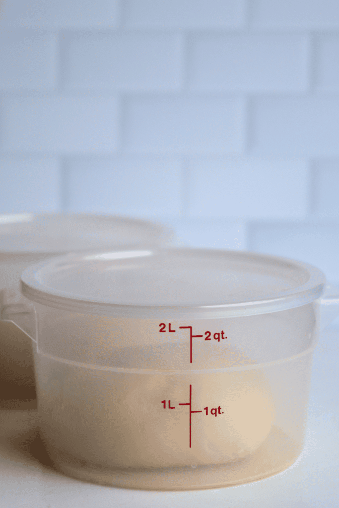 divided dough placed in bowls