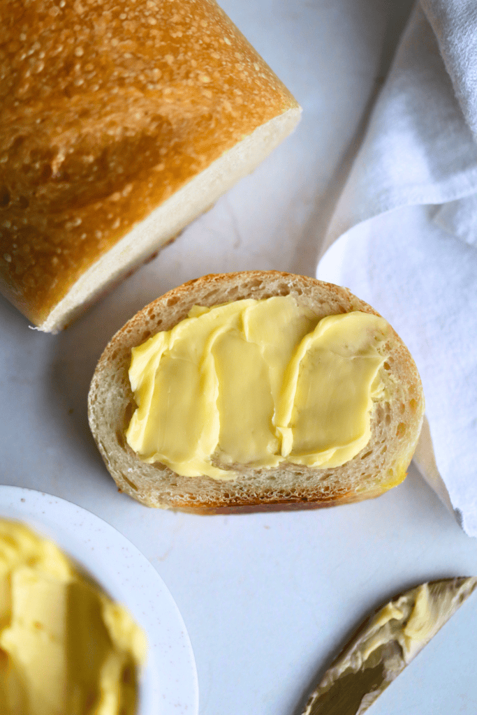 a slice of sourdough french bread with butter