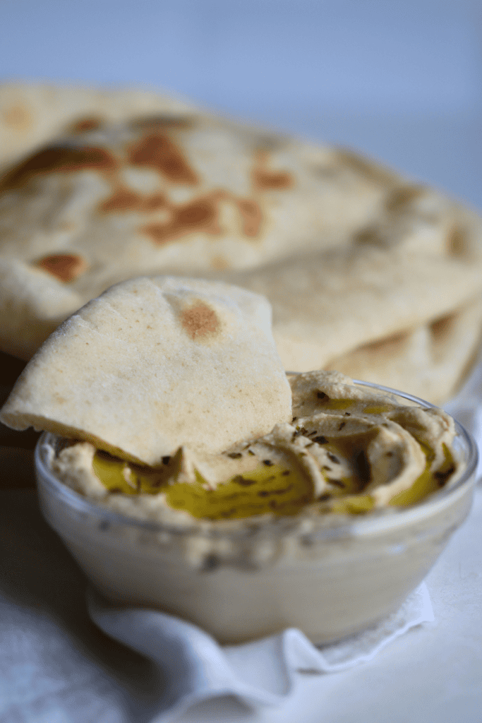 sourdough pita bread dipped into the sauce