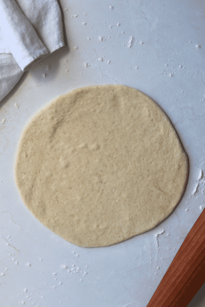 dough rolled flat on a surface