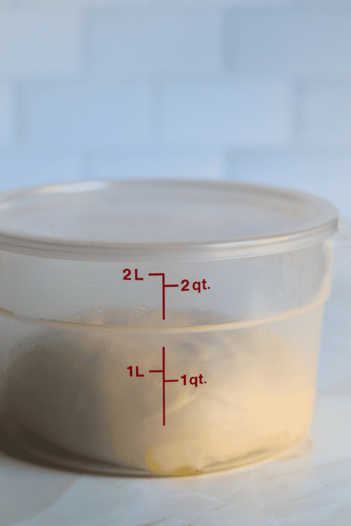dough placed in greased bowl and covered