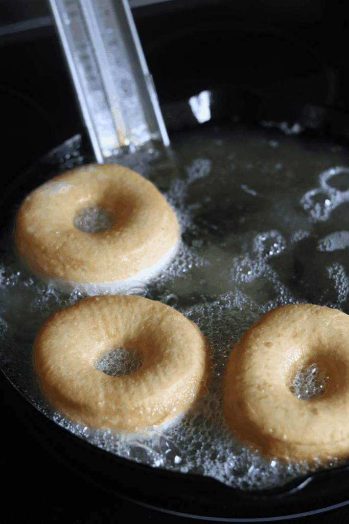 flipped sourdough donuts while frying